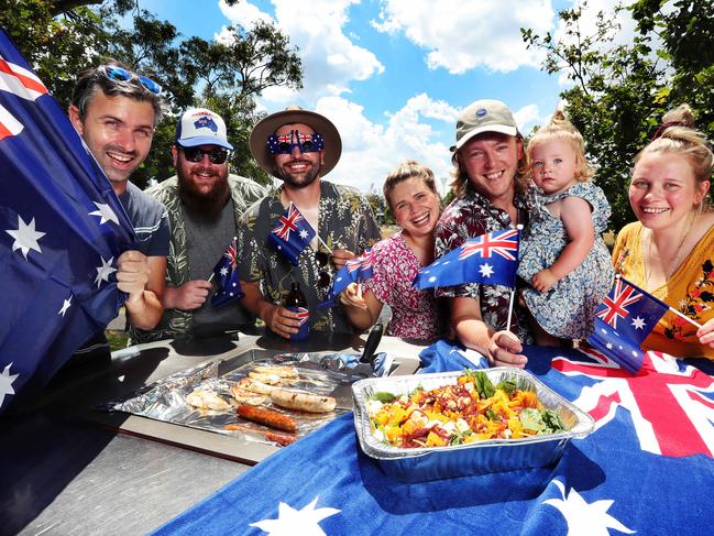 Murray Charles, David Packer, Joe Robins, Amelia Wal, Matt Clarke, Tilly and Emma Clarke barbecue along the Yarra River. Picture Rebecca Michael