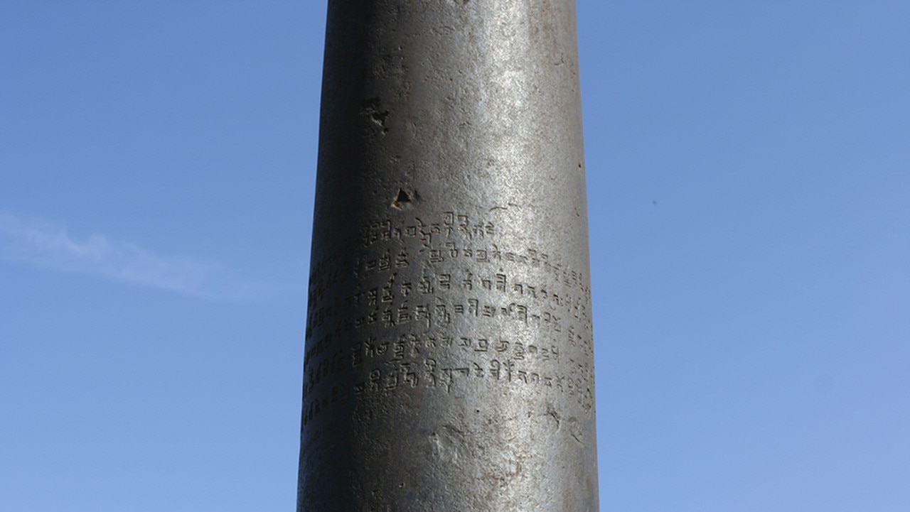 The inscription on the Iron Pillar’s dull-grey surface dedicating it to god Vishnu and naming a ruler called Chandra. Source: Wikimedia
