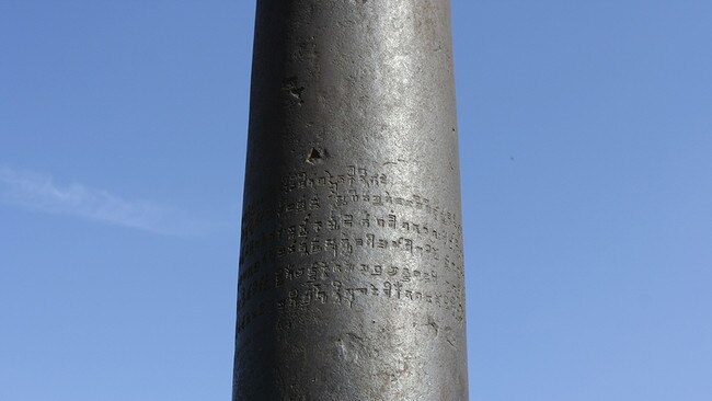 The inscription on the Iron Pillar’s dull-grey surface dedicating it to god Vishnu and naming a ruler called Chandra. Source: Wikimedia