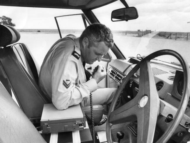 1976: Senior Constable First Grade John Reed, of Ceduna, uses the two way radio at Nullarbor Station, South Australia. Picture: Neon Martin/File