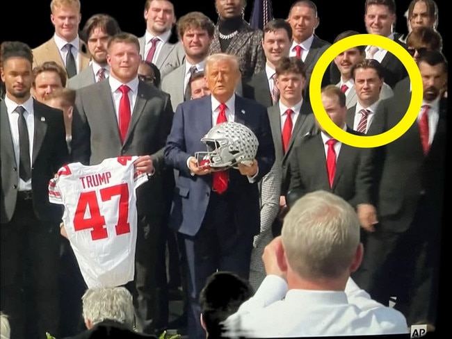 Joe McGuire standing on stage with Donald Trump