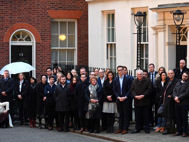 Number 10 special Adviser Dominic Cummings and other members of Britain's Prime Minister Boris Johnson's staff, listen as he delivers a speech outside 10 Downing St. Picture: AFP