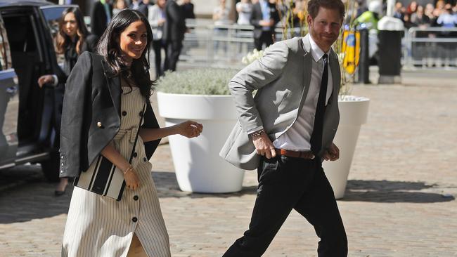 Prince Harry and Meghan Markle arrive at the Queen Elizabeth II Centre. Picture: AP.