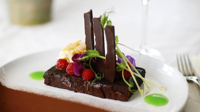 Warm Dutch chocolate and coconut brownie with raspberries and hot fudge sauce. Picture: MATT THOMPSON