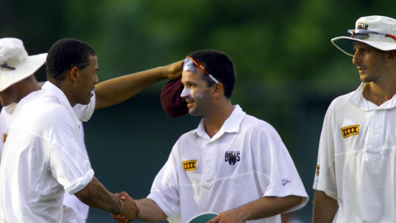 Andrew Symonds (left) congratulates Queensland teammate Adam Dale. Dale finished the innings the following day with 7-33. /cricket