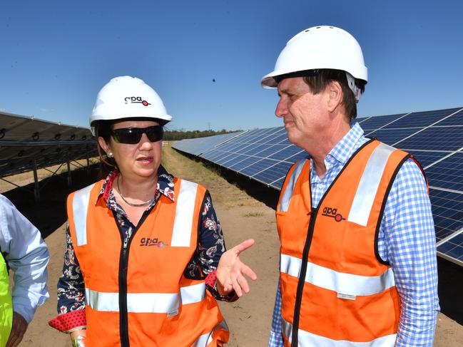 Queensland Premier Annastacia Palaszczuk (left) and Queensland Minister for Natural Resources, Mines and Energy, Dr Anthony Lynham are seen visiting the Darling Downs solar farm in Miles, Tuesday, January 23, 2018.  Premier Palaszczuk has proposed that ten solar farms and the Cooper's Gap wind farm will be built in the western Darling Downs which will generate 2.41 gigawatts of electricity and 3120 construction jobs. (AAP Image/Darren England) NO ARCHIVING