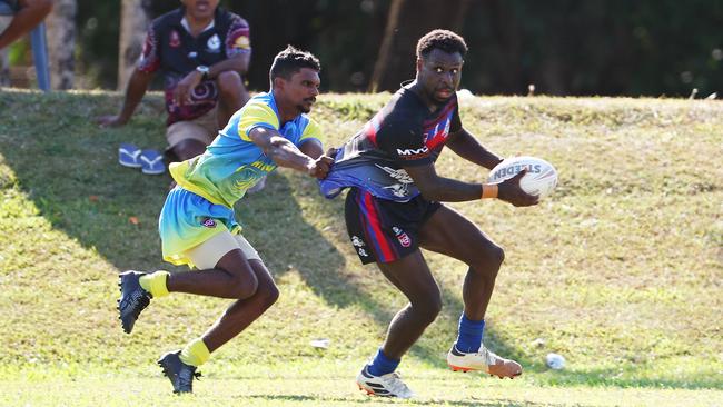 Darringhi's Jabin Miller tackles Coastal Balaz' Deva Zaro in the semi final match of the Gordonvale Indigenous Rugby League Carnival, held at Alley Park. Picture: Brendan Radke