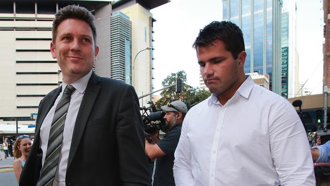 Not guilty: Gable Tostee leaves Brisbane Supreme Court with his lawyer Nick Dore. PIC: Claudia Baxter