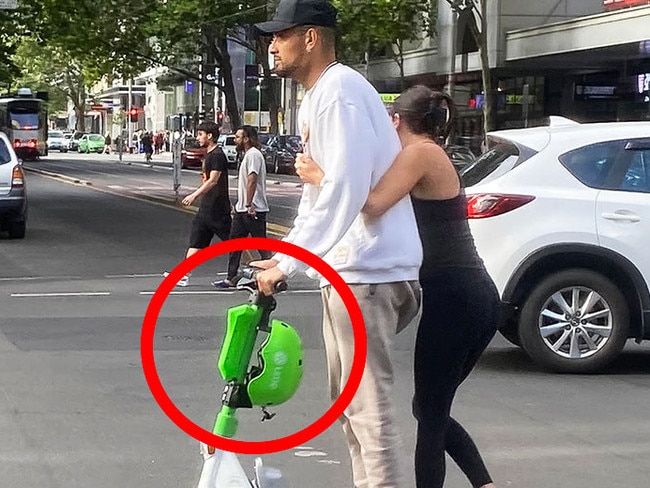 Nick Kyrgios riding an e-scooter in Melbourne. (AAP Image/James Ross)