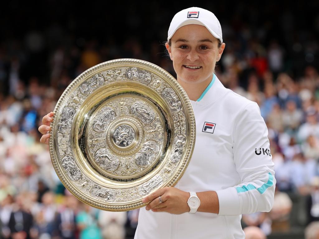 The now-retired Ashleigh Barty with the Wimbledon trophy last year. This year’s women’s champion will receive £2 million, as will the men’s winner. Picture: Clive Brunskill/Getty Images