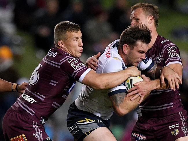 Trent Hodkinson (left) is a weak link in defence for Manly. Picture: AAP