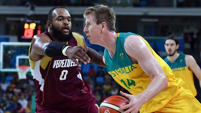 Australia's power forward Brock Motum (R) works around Venezuela's centre Gregory Echenique during a Men's round Group A basketball match between Australia and Venezuela at the Carioca Arena 1 in Rio de Janeiro on August 14, 2016 during the Rio 2016 Olympic Games. / AFP PHOTO / Andrej ISAKOVIC