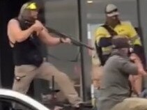 One of the police officers at the scene was wearing a Centrelink singlet. Picture: Supplied
