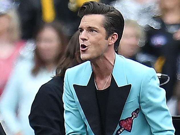 The Killers perform before the AFL grand final between the Adelaide Crows and Richmond Tigers at the MCG in Melbourne, Saturday, September 30, 2017. (AAP Image/Julian Smith) NO ARCHIVING, EDITORIAL USE ONLY