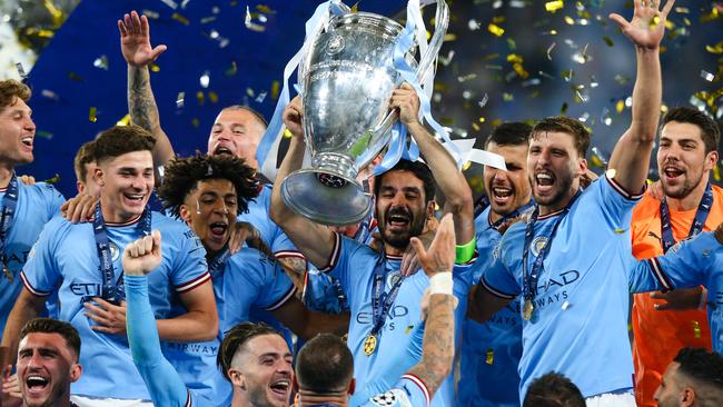 ISTANBUL, TURKEY - JUNE 10:  Ilkay Gundogan of Manchester City lifts the trophy and celebrates with team mates after the UEFA Champions League 2022/23 final match between FC Internazionale and Manchester City FC at Atatuerk Olympic Stadium on June 10, 2023 in Istanbul, Turkey. (Photo by Craig Mercer/MB Media/Getty Images)