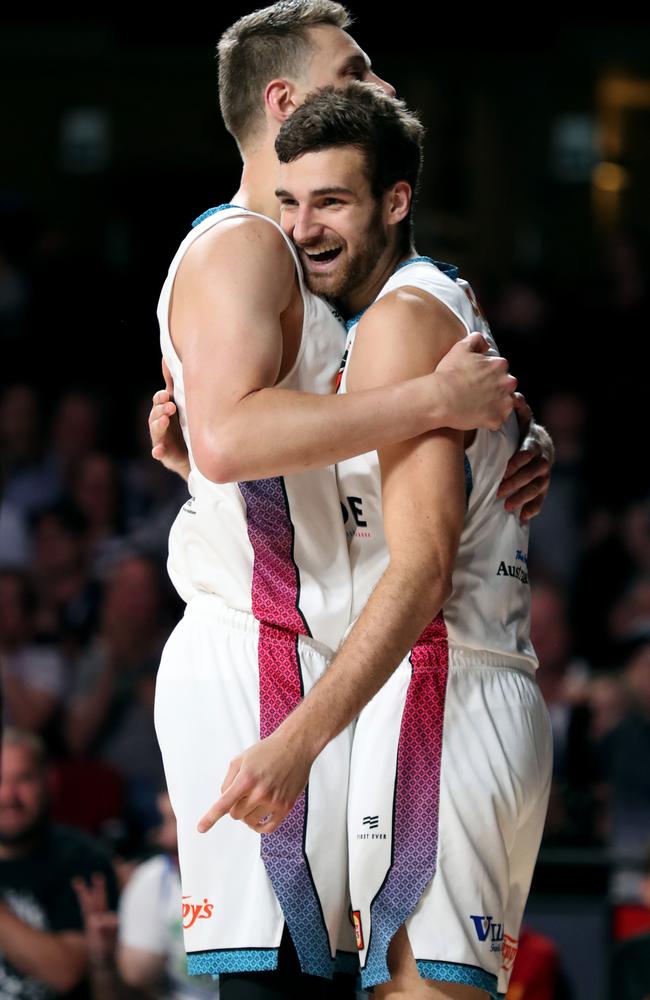 Daniel Johnson and Jack McVeigh celebrate a basket during their win over New Zealand. Picture: Kelly Barnes (AAP)