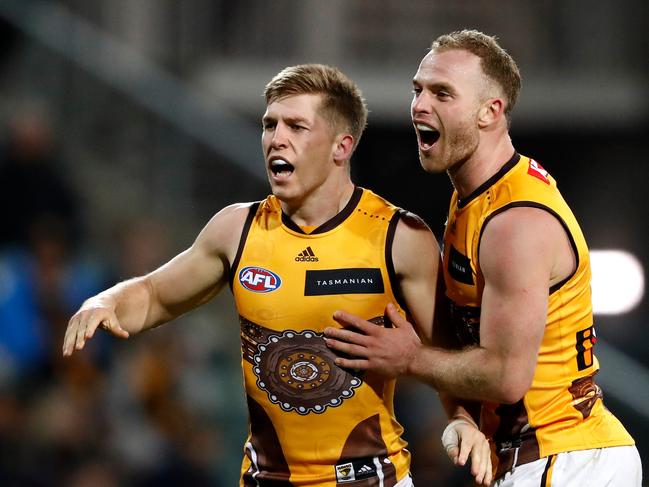 LAUNCESTON, AUSTRALIA - MAY 22: Dylan Moore of the Hawks celebrates a goal with Tom Mitchell of the Hawks during the 2022 AFL Round 10 match between the Hawthorn Hawks and the Brisbane Lions at UTAS Stadium on May 22, 2022 in Launceston, Australia. (Photo by Dylan Burns/AFL Photos via Getty Images)