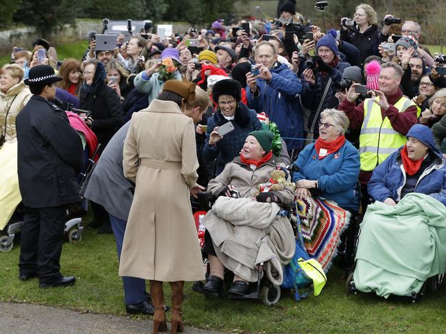 Meghan Markle and Prince Harry were a big hit with the crowds who lined up to see them. Picture: AP/Alastair Grant