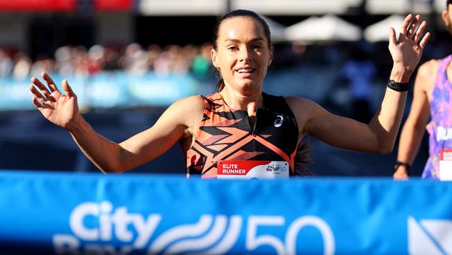 Women’s winner Izzi Batt-Doyle crosses the finish line. Picture: Kelly Barnes