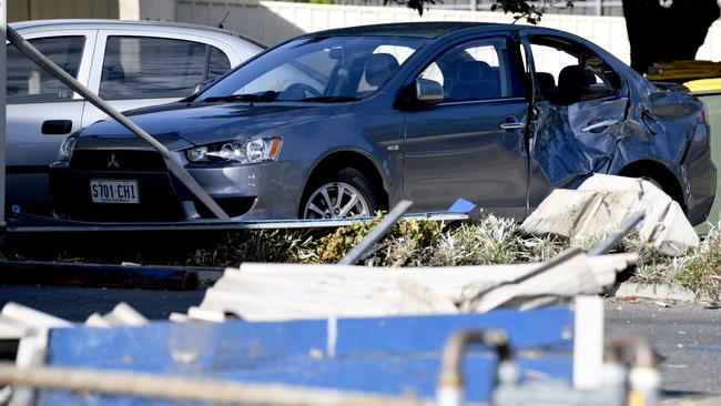 The car after it accelerated through the fence. Picture: NCA NewsWire/Naomi Jellicoe