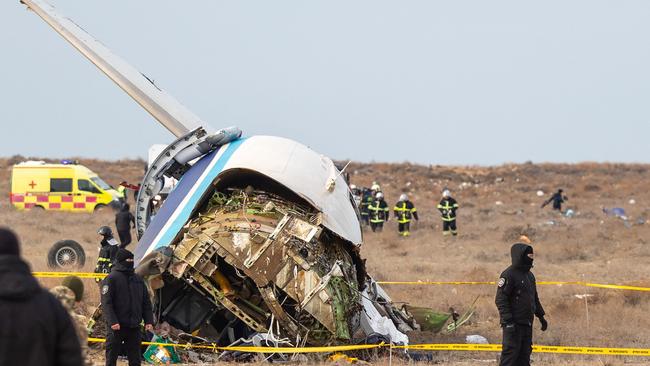 Emergency specialists work at the crash site of the Azerbaijan Airlines plane near the western Kazakh city of Aktau. Picture: AFP