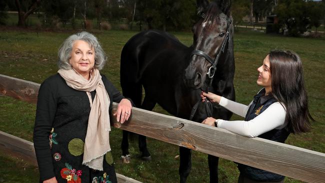 Maggie Dawkins with her daughter Alice and horse Grace at Innisfree vineyard. Picture: Dylan Coker 