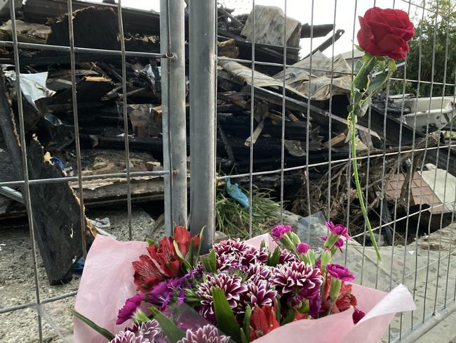 Flowers at the scene where two bodies where found overnight after a unit fire in Browns Plains - Photo NILSSON JONES