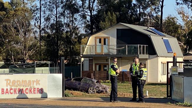 A 16yo driver and a 24yo passenger are fighting for life after this stolen Ford sedan clipped a light pole and flipped into this yard in Renmark at 2:30am. Another 18yo passenger is also in hospital with minor injuries. Picture: Casey Treloar/7 NEWS (source: Twitter)