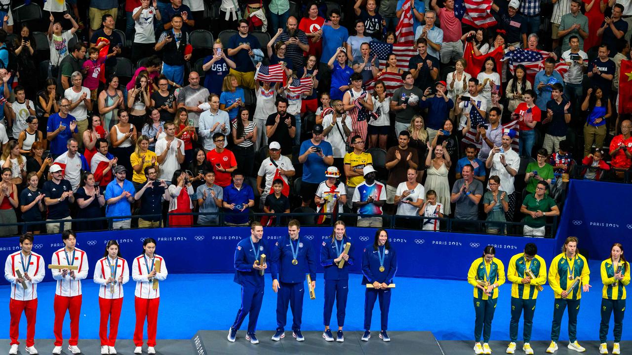 Silver medallists China, gold medallists USA and bronze medallists Australia on the podium of the mixed 4x100m medley relay final. Photo by FranÃ§ois-Xavier MARIT / AFP