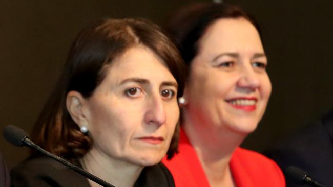 NSW Premier Gladys Berejiklian and Queensland Premier Annastacia Palaszczuk. Picture: AAP/Kelly Barnes