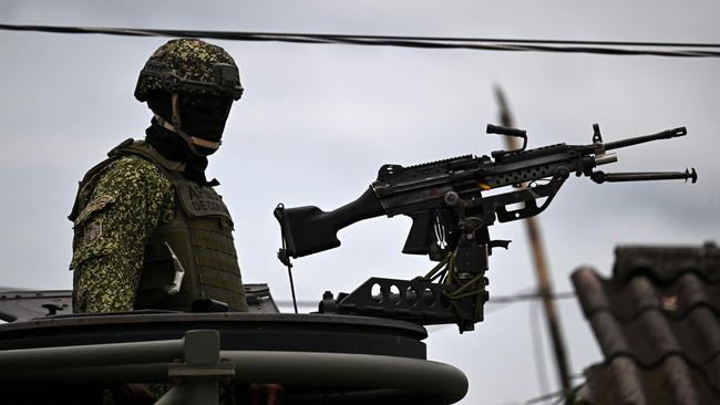 Colombian marines patrol during security operations before the arrival of Prince Harry and Meghan in San Basilio de Palenque, Colombia. Picture: Raul Arboleda/AFP