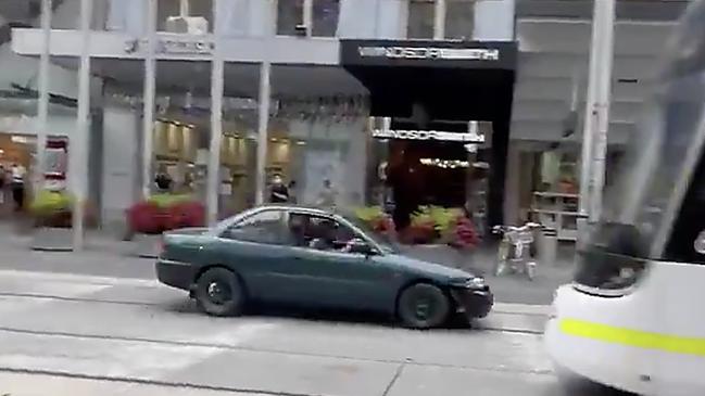 The green car raced down Bourke St. Picture: Supplied.