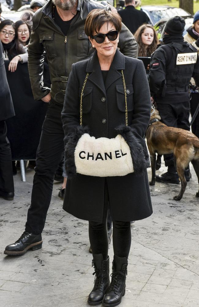 Chanel model walks a dog on the catwalk