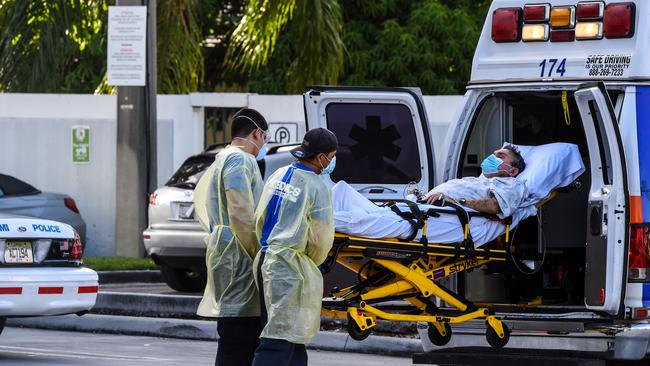 Medics transfer a Covid patient in Coral Gables near Miami. Picture: AFP