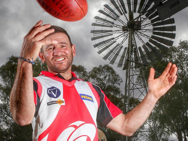 HOLD FOR SUNDAY HERALD SUN- Country football Stars, Robinvale star Don Falvo in front of the towns windmill  , Robinvale. 21st September 2015. Picture: Colleen Petch.