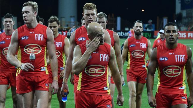 Gary Ablett leading the Suns off the Simonds Stadium. Picture: AAP