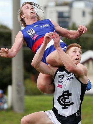 Mitch Hannan leaps onto Matthew Dick’s shoulders.