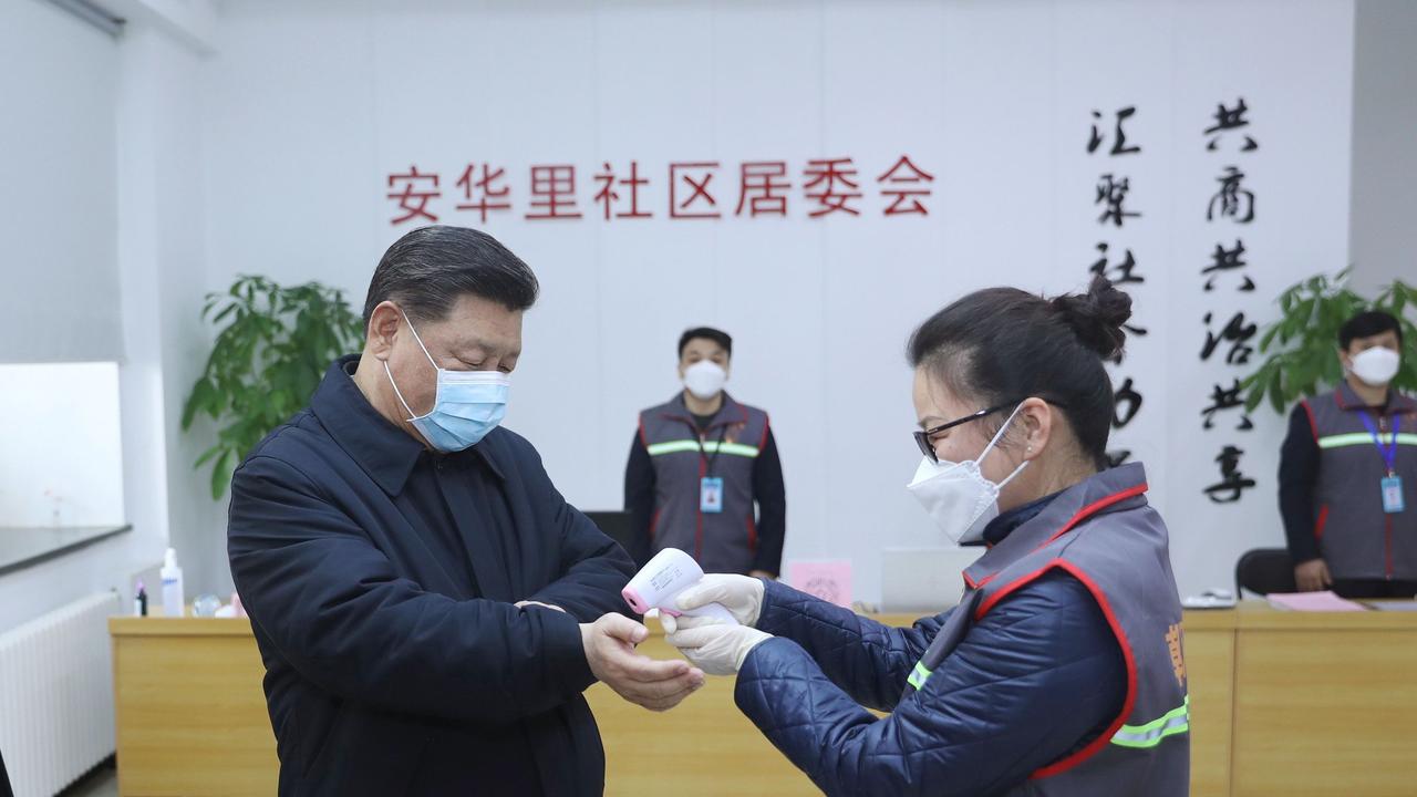 Mr XI had his temperature checked during the inspection. Picture: AP/Xinhua/Ju Peng