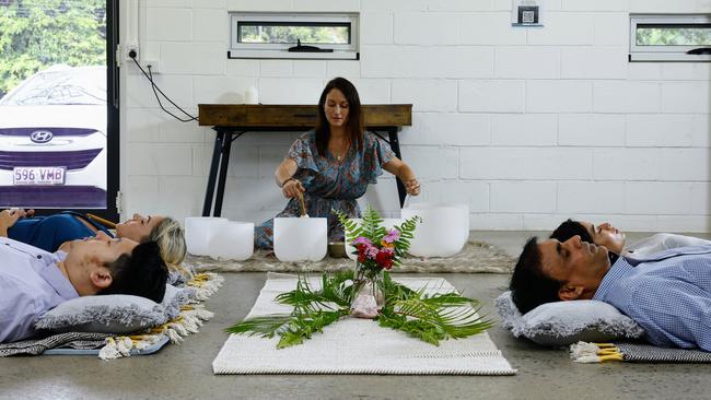 Centacare offers a range of free support services to help people identify and overcome metal health issues in their life, such as anxiety and depression. Centacare resilience coach Jasmyn Grundy hosts a meditation session using sound therapy for William Vue, Leanne Edward, Divya Basnet and Suresh Nambooriyothmeethal. Picture: Brendan Radke