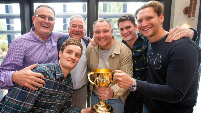 The Lanskey family celebrate their Melbourne Cup win in St Kilda. Picture: Mark Stewart