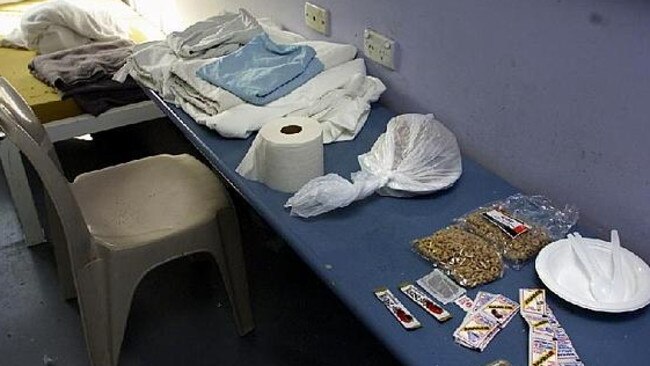 Curtis would be lucky not to have to share his cell (above, with basics such as toilet paper and breakfast pack) with another inmate. Picture: News Corp