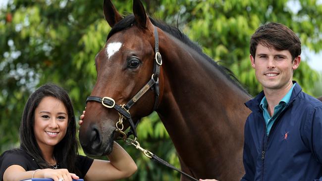 Racing royalty James Cummings and wife Monica take a look at a Torryburn Colt by Redoute's Choice at the Magic Millions Sales complex. Picture: Adam Head