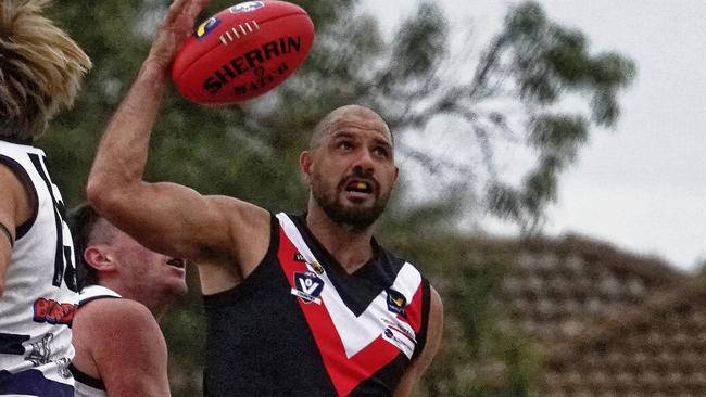 Paddy Ryder in action for Devon Meadows against Pearcedale in MPFNL Division 2 on Saturday. Picture: Valeriu Campan