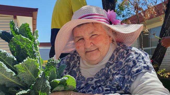 Carinity Karinya Place resident Shirley Sing with vegetables harvested from the aged care community's garden. Photo: Supplied.