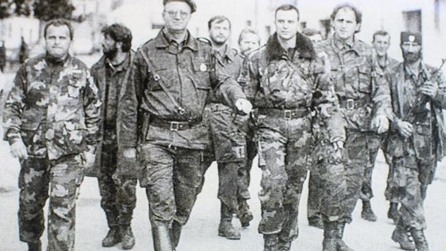 Zoran Tadic (L) with (3rd L in beret) Vojislav Seselj, Serbian politician convicted of war crimes at The Hague.