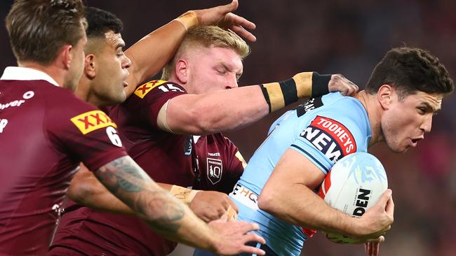 BRISBANE, AUSTRALIA - JUNE 21:  Mitchell Moses of the Blues is tackled during game two of the State of Origin series between the Queensland Maroons and the New South Wales Blues at Suncorp Stadium on June 21, 2023 in Brisbane, Australia. (Photo by Chris Hyde/Getty Images)