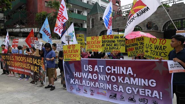 Protesters hold placards that read “US and China don’t drag us into war” during a rally in front of the military headquarters in Manila on April 22, 2024, to coincide with the opening ceremony of the Balikatan joint military exercise. Picture: AFP