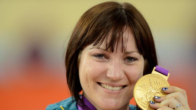 **FILE** A Aug. 7, 2012 file photo of Australia's Anna Meares holding her gold medal after defeating Victoria Pendleton in the women's sprint at the Velodrome during the Olympic Games in London. Cycling great Anna Meares has announced her retirement today, Sunday, Oct. 16, 2016. (AAP Image/Dean Lewins) NO ARCHIVING, EDITORIAL USE ONLY