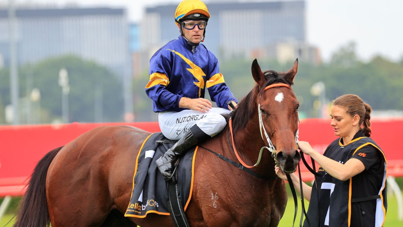 SYDNEY, AUSTRALIA - FEBRUARY 13: Tommy Berry on Masked Crusader returns to scale after winning  race 6 the Cellarbrations Southern Cross Stakes during Sydney Racing at Royal Randwick Racecourse on February 13, 2021 in Sydney, Australia. (Photo by Mark Evans/Getty Images)