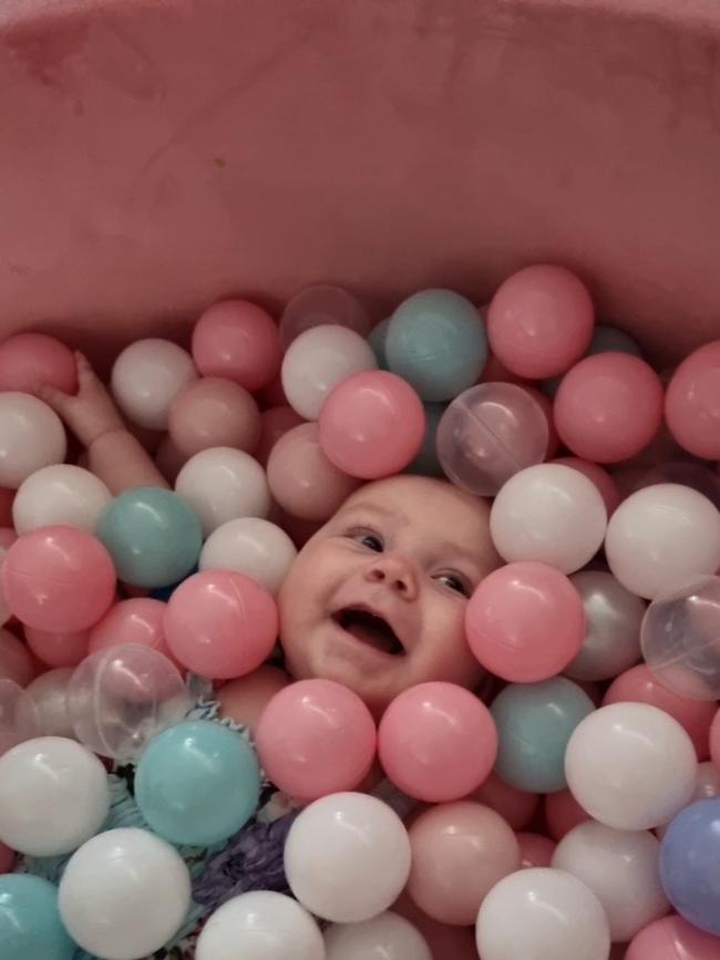 Summer Ryan, six months old. Summer loves blowing spit bubbles, she loves her bottles and lights up every room with her big smile.